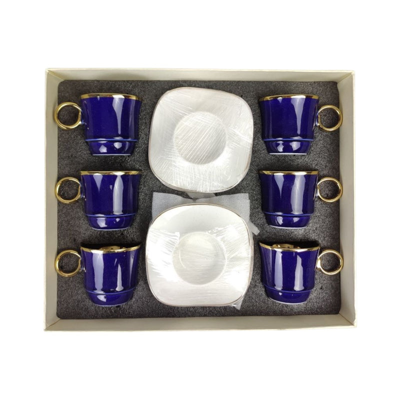 Set of six blue ceramic cups with gold handles and two white ceramic plates in a box.