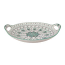 Decorative ceramic serving dish with green and black patterns on a white background
