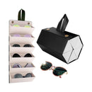 Sunglasses in a holder with a black geometric sunglasses case on a white background