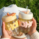 Cute glass cup with straw and silicone WOW letters – with lid for juice, milk, or smoothies – cupindy