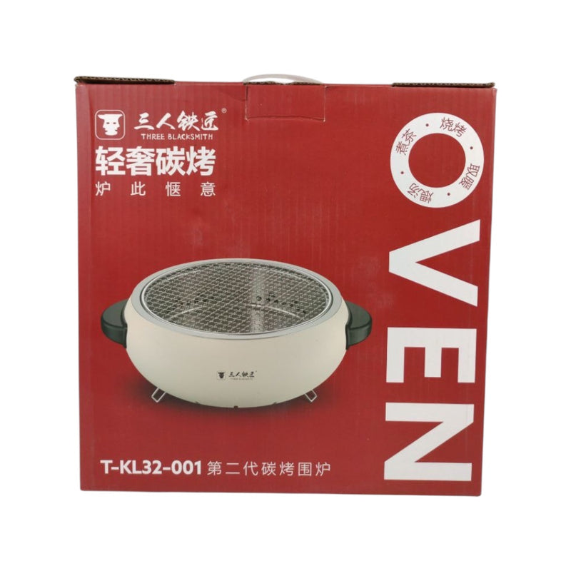 Red box packaging for an oven with brand logo and product image on a white background