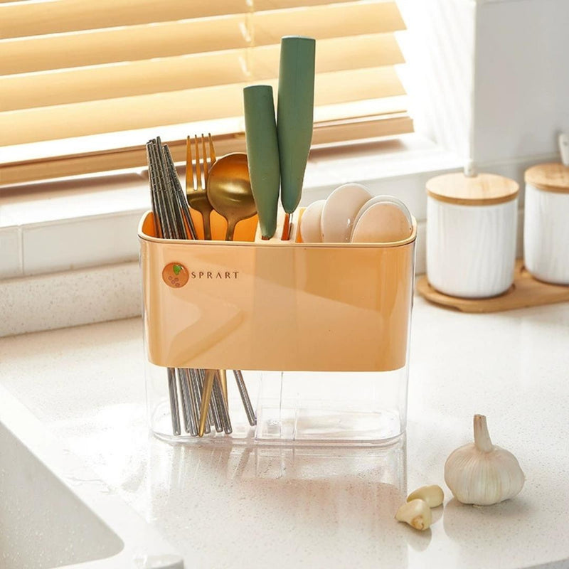 Kitchen utensil holder with cutlery on a kitchen counter