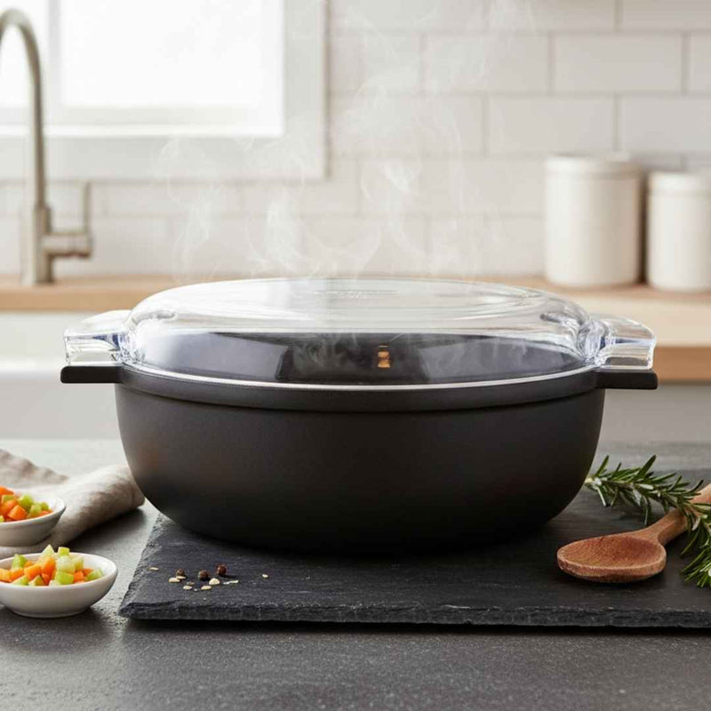 Black cookware set with glass lid on a kitchen counter