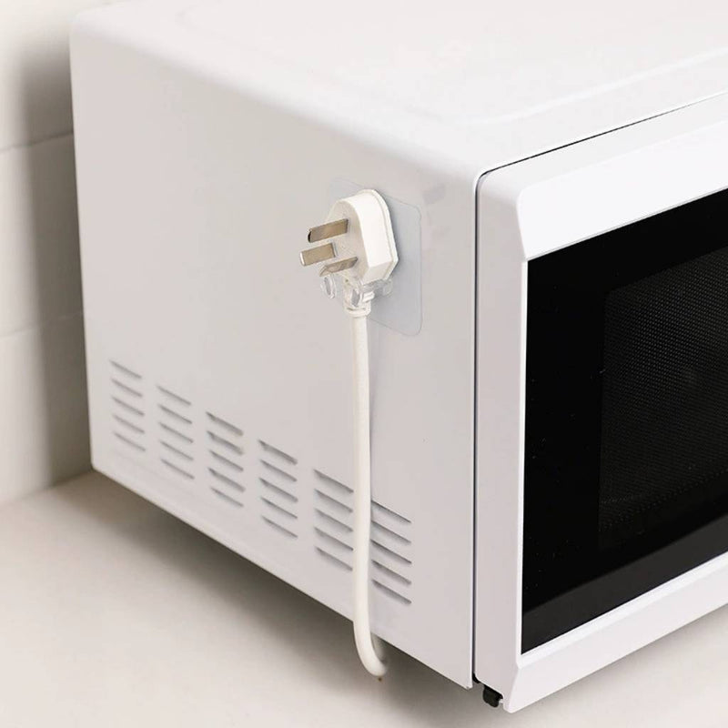 Plug holder for wall mounting, invisible design, reusable and space-saving | Cupindy