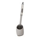 Gray and white toilet cleaning brush on a white background