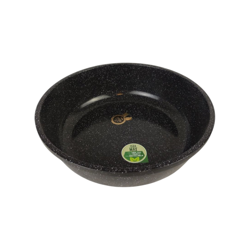 Black speckled frying pan with a green label on a white background