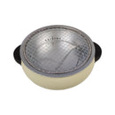 Round grill with metallic top and beige body on a white background