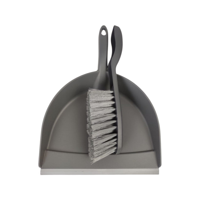 Gray dustpan and brush set on a white background
