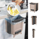 Foldable hanging trash bin for kitchen cabinet doors with space-saving design
