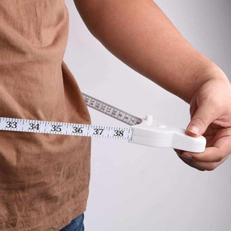 Fitness trainer using body tape to check arm circumference