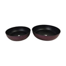 Two black bowls on a white background