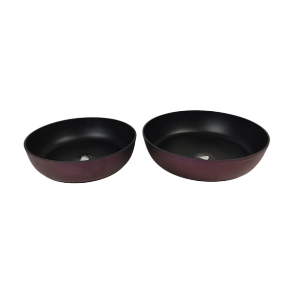 Two black bowls on a white background