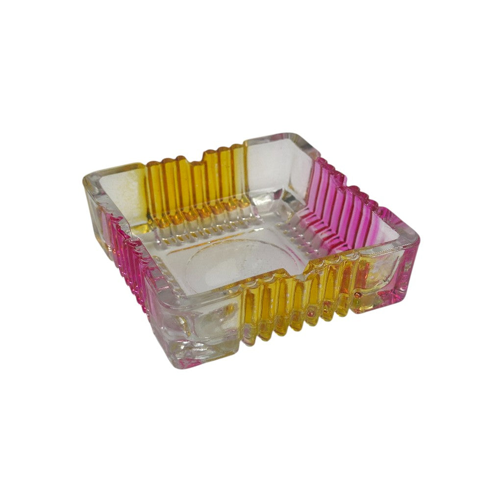 Square transparent glass ashtray with ribbed yellow and pink edges, modern decorative smoking accessory