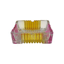 Front view of square glass ashtray with ribbed yellow and pink sides, decorative and functional design