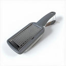 Gray handheld grater on a white background