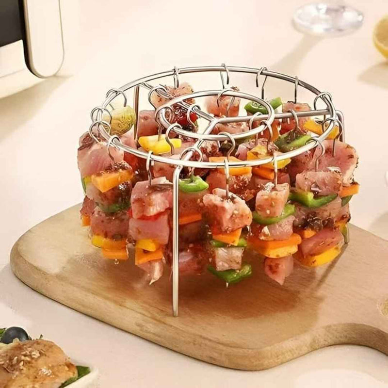 Skewer holder with marinated meat and vegetables on a wooden board