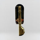 Gold kitchen utensil set with packaging on a light gray background