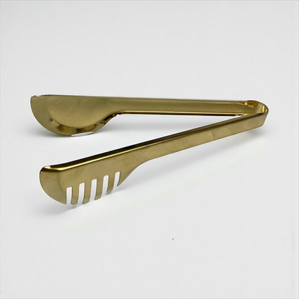 Gold tongs on a white background