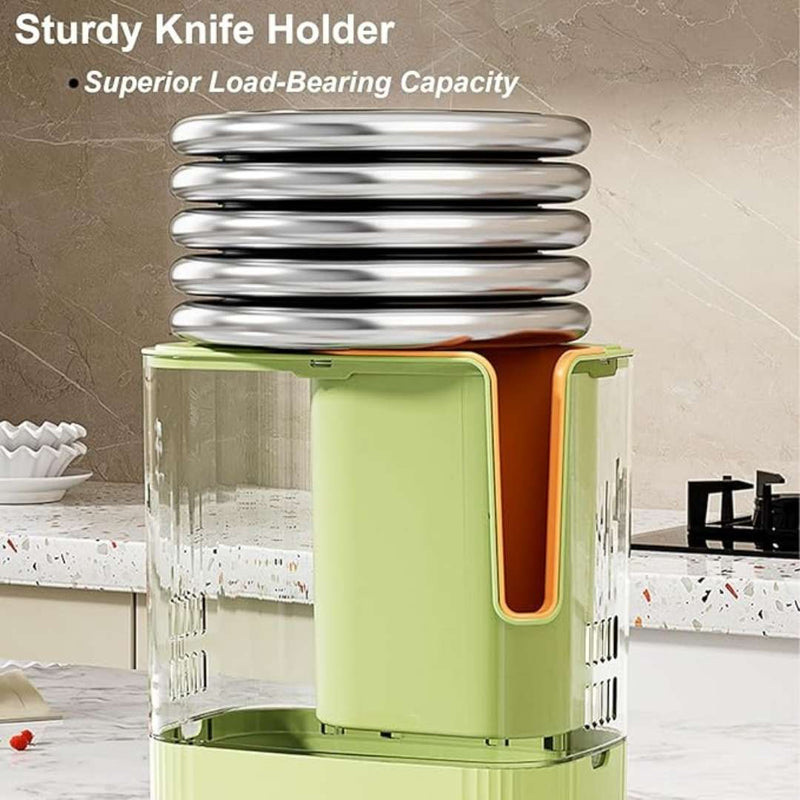 Green knife holder with stacked silver blades on a kitchen counter.