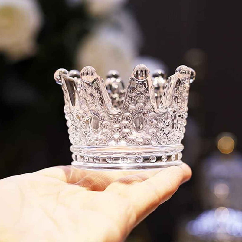 Clear glass candle holder with royal crown design
