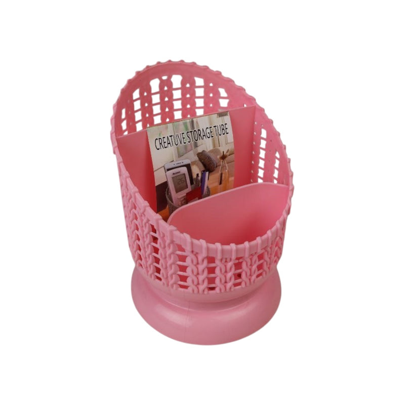 Pink woven storage basket with a book titled 'Creative Storage' on a white background