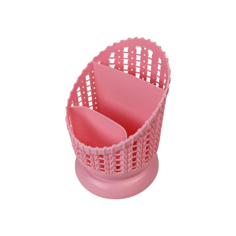 Pink plastic utensil holder with a white background