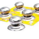 Stainless steel replacement pot lid knobs arranged on yellow packaging.