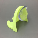 Secure razor storage with a wall-mounted suction cup holder.