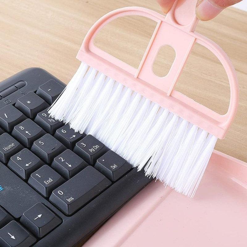 Pastel-colored mini dustpan and brush set for efficient cleaning.