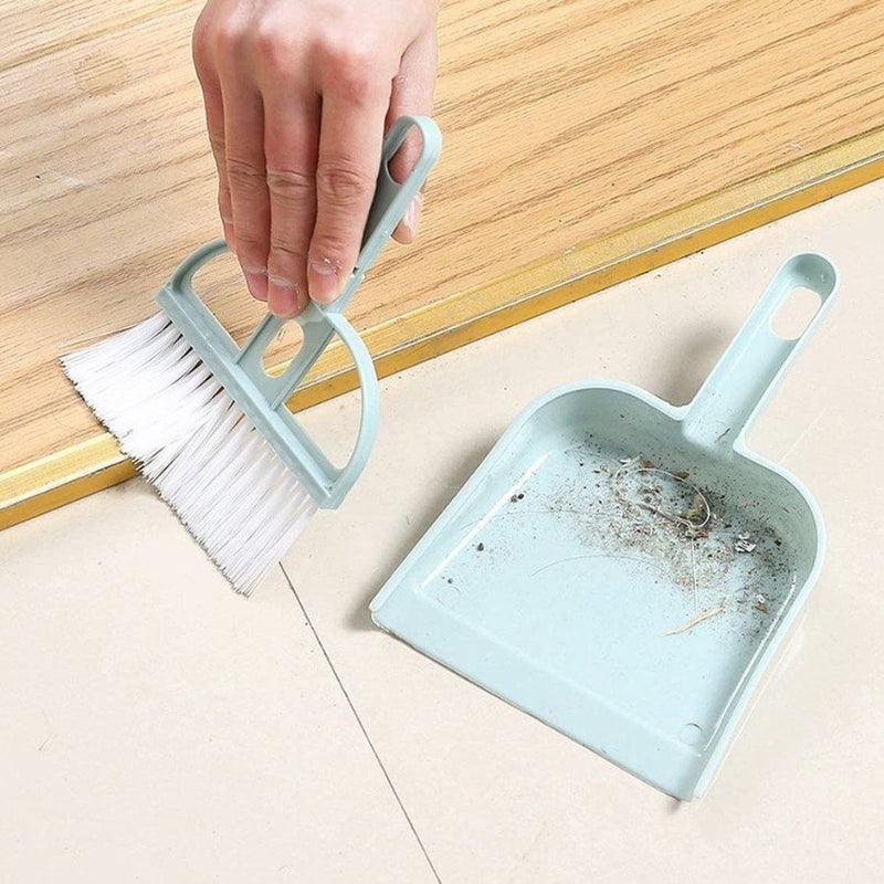 Handy mini broom and dustpan set in soft colors for home use.