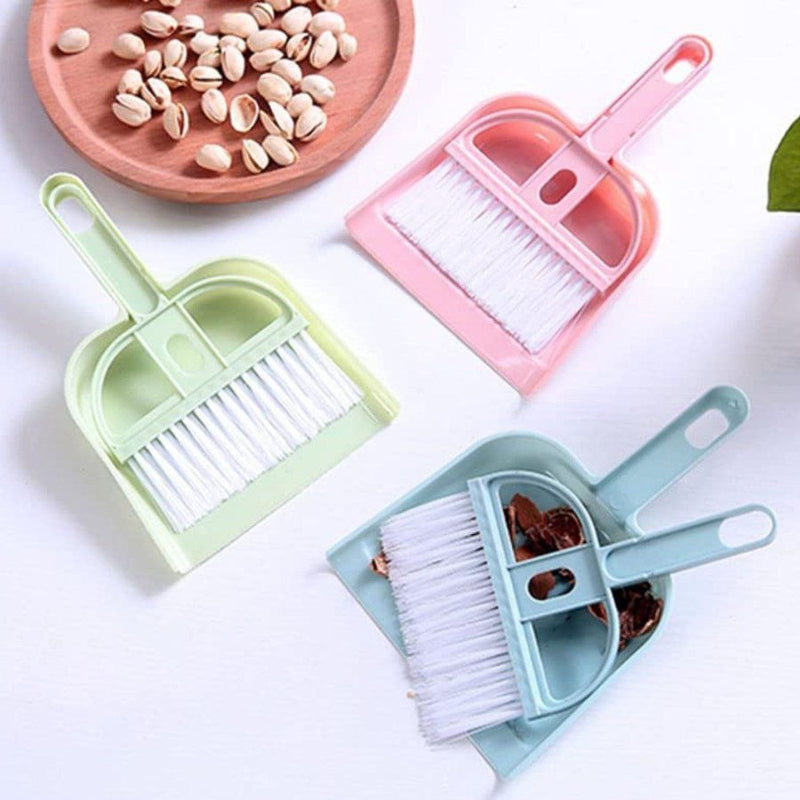 Mini broom and dustpan set in pastel colors for quick clean-ups.