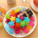 Bright and colorful reusable ice cubes in a glass.